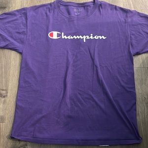 A purple champion athletic wear shirt
